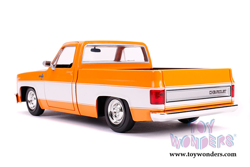 Jada Toys Just Trucks - Chevrolet&reg; C10 Pickup Stock (1985, 1/24 scale diecast model car, Glossy Orange/White) 31607
