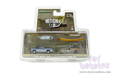 Greenlight - Hitch & Tow Series 25 | 1988 GMC&reg; S-15 Sierra Pickup Truck and Canoe Trailer with Canoe Rack, Canoe and Kayak (1/64 scale diecast model car, Blue) 32250C/24