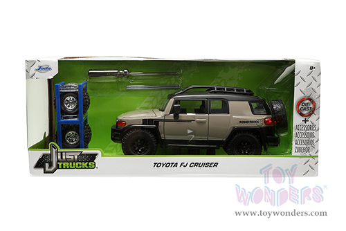 Jada Toys Just Trucks - Toyota FJ Cruiser with Roof Rack and Extra Wheels (1/24 scale diecast model car, Brown/Black) 34008