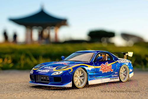 Jada Toys - Hollywood Rides | Mazda RX-7 with Chun-Li Diecast Figure "Street Fighter" (1993, 1/24, diecast model car, Blue) 30838