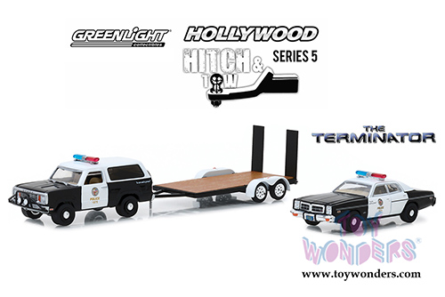 Greenlight - Hollywood Hitch & Tow Series 5 | The Terminator (1984 movie) 1977 Dodge Ramcharger with 1977 Dodge Monaco Metropolitan Police on Flatbed Trailer (1/64 scale diecast model car, Black w/White) 31060C/24