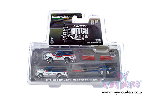 Greenlight - Racing Hitch & Tow Series 3 | Ford F-150 Pickup Truck and Ford Bronco with Flatbed Trailer BFGoodrich (1992, 1/64 scale diecast model car, Blue/White) 31110A/24