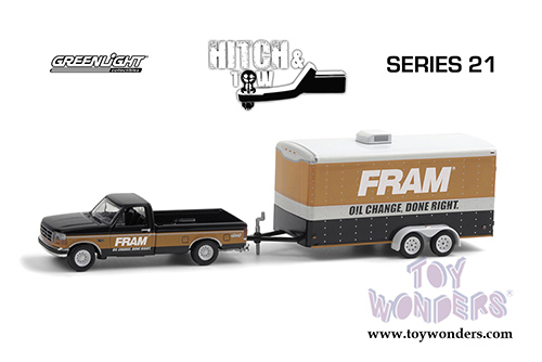 Greenlight - Hitch & Tow Series 21 | Ford F-150 XLT Pickup Truck with Enclosed Car Hauler "FRAM Oil Filters" (1994, 1/64 scale diecast model car, Black/Orange) 32210B/24