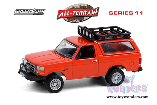 Greenlight - All Terrain Series 11 | Ford Bronco Sport with Off-Road Parts (1995, 1/64 scale diecast model car, Orange) 35190D/48