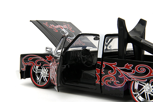 Jada Toys - Hollywood Rides | 1985 Chevrolet® C10 Pickup Truck with Charro Man figure - Tapatio Day of The Dead (1985, 1/24, diecast model car, Black with red/w White top) 35476