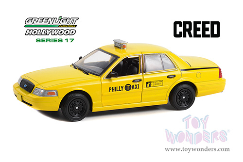 Greenlight Hollywood Series 17 | Ford Crown Victoria "Philly Taxi" "Creed" (2015 Movie) (1999, 1/24 scale diecast model car, Yellow) 84173